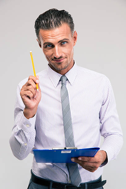 istock Businessman holding pencil and clipboard 485265662