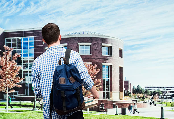 istock Rear view of male student in university 485266532