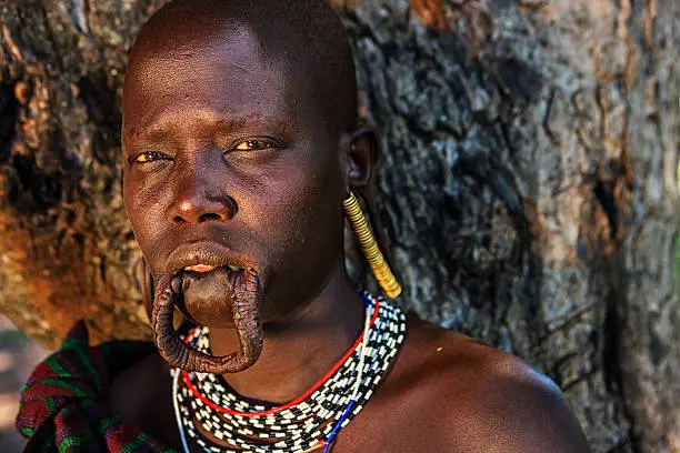 Mursi tribe are probably the last groups in Africa amongst whom it is still the norm for women to wear large pottery or wooden discs or ‘plates’ in their lower lips.http://bem.2be.pl/IS/ethiopia_380.jpg
