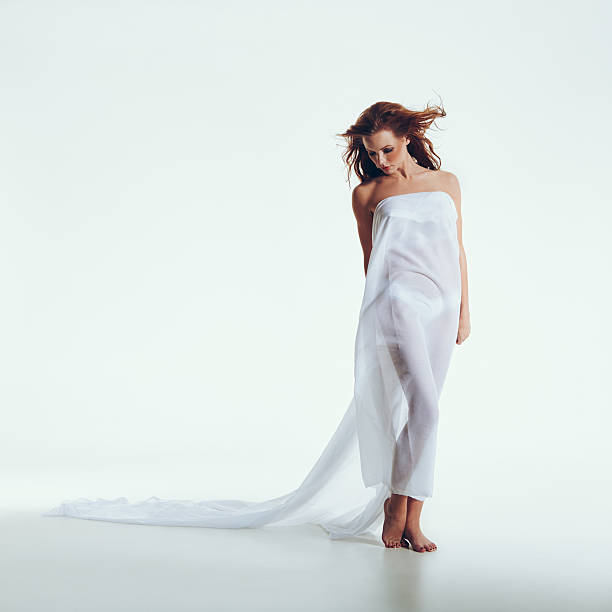 istock Nude woman covered with transparent textile 485272526