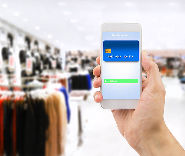 istock using the smartphone at the store to make payment 485272922