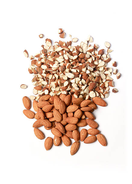 istock almond,almonds crushed on white background 485273136