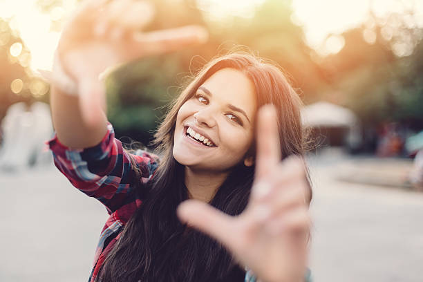 istock Young girl making finger frame 485275958