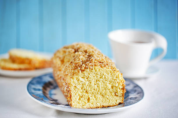 Cake made with shredded coconut, pound cake with tea stock photo