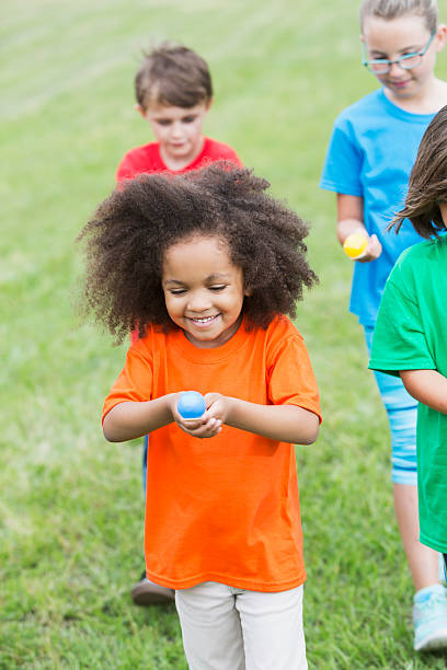 istock Multiracial group of children in an egg spoon race 485278092