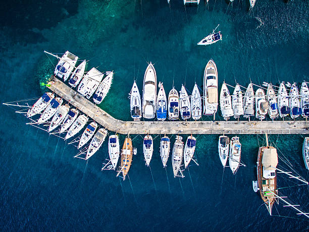 Marina bay with sailboats and yachts Aerial view on marina bay with sailboats and yachts.  http://santoriniphoto.com/Template-Sailing.jpg marina stock pictures, royalty-free photos & images