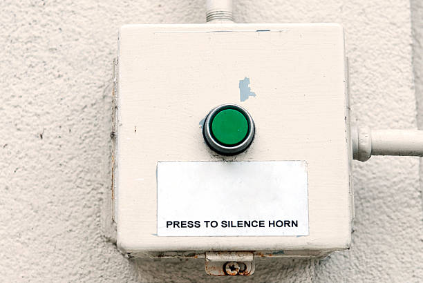 istock Button to silence horn on wall of building 485284518