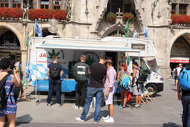 Demonstration in Munich Munich, Germany - August 22. 2015: German activists (Cannabis Verband) collect signatures for legalization of cannabis in Germany at Marienplatz square. bayer schering pharma ag photos stock pictures, royalty-free photos & images