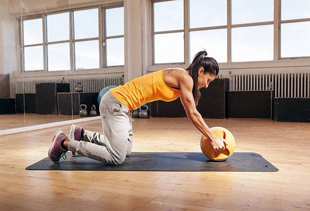 istock Young woman exercising with kettle bell 485286296