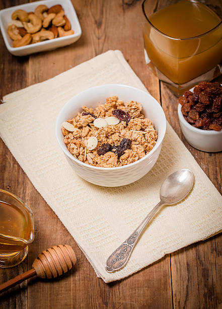 istock Granola, honey, nuts and raisins 485288930