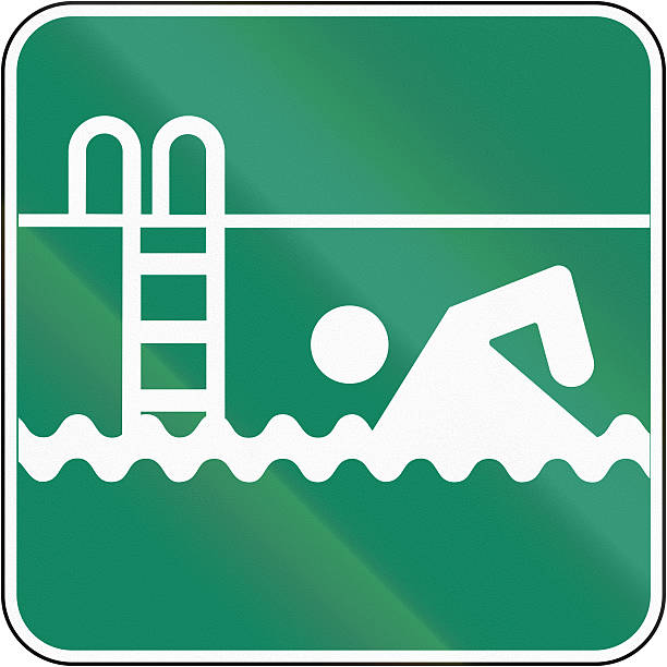 Guide and information road sign in Quebec, Canada - Outdoor swimming pool.