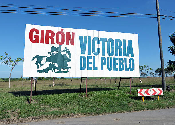 Roadside propaganda, Cuba Giron, Cuba, October 29th 2012, Much roadside acclamation still remains such as this reference to the 'Bay of Pigs' invasion by CIA backed mercenaries - Giron - Victory by the People' bay of pigs invasion stock pictures, royalty-free photos & images