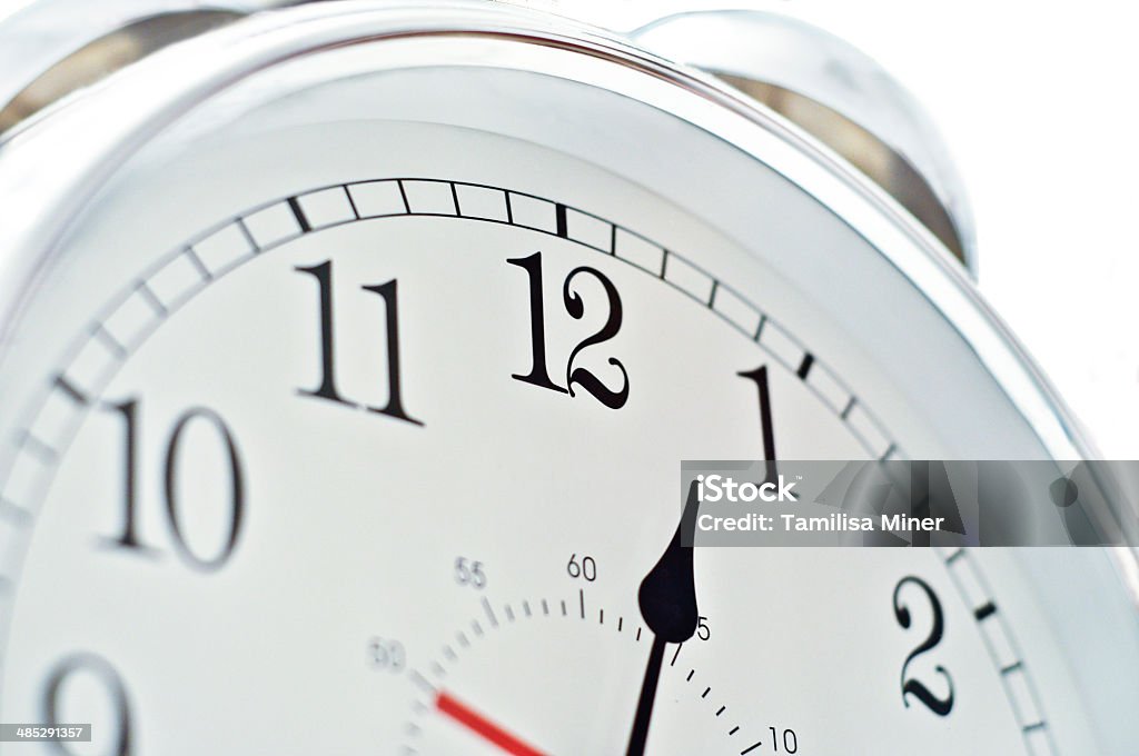 Big Time A close up view of a clock face. Alarm Clock Stock Photo