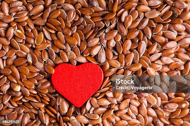 Healthy Diet Flax Seeds Linseed As Food Background And Heart Stock Photo - Download Image Now