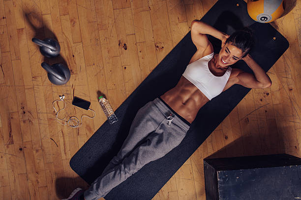 istock Smiling female working out at the gym 485293304