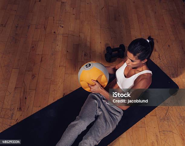 Strong Young Woman Doing Core Workout Stock Photo - Download Image Now - 20-29 Years, 2015, Adult