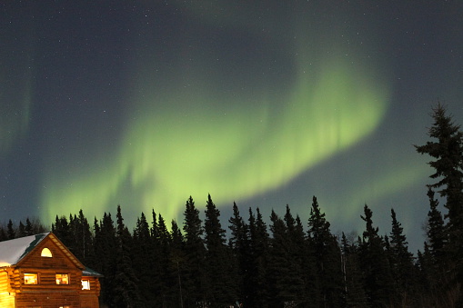 The Northern Lights (aurora borealis) as seen from the Taste of Alaska Lodge in Fairbanks, AK in March 2013.