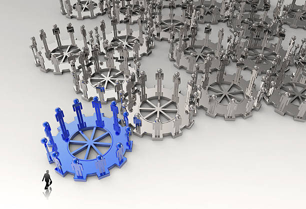 istock businessman walking to 3d figures on connected cogs as leadershi 485296123