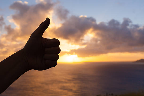 istock Thumbs up to beautiful sunset 485296187