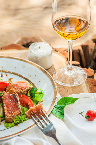 Fresh salad with lettuce and fried salmon stock photo