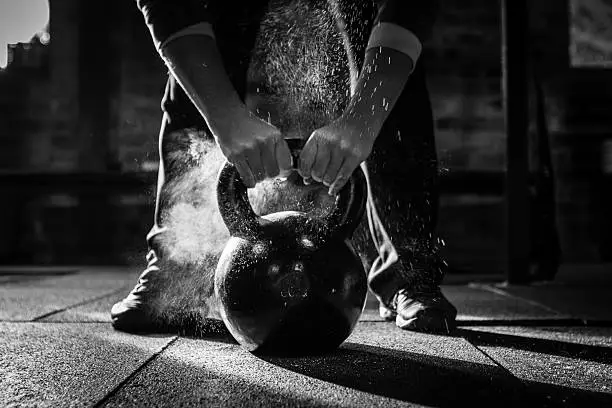 Photo of gym Kettle Bell with chalk and hands