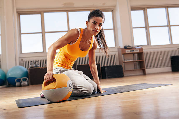 istock Fit young woman exercising with kettle bell 485302024