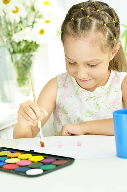 istock Little girl drawing at home 485302334