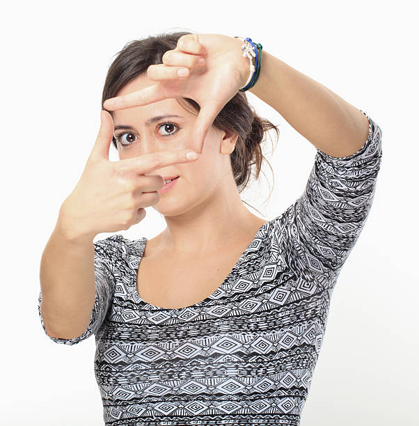 istock Smiling Young Woman Makes Finger Frame. 485310445