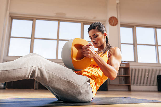 istock Muscular young woman doing gym workout in gym 485311082