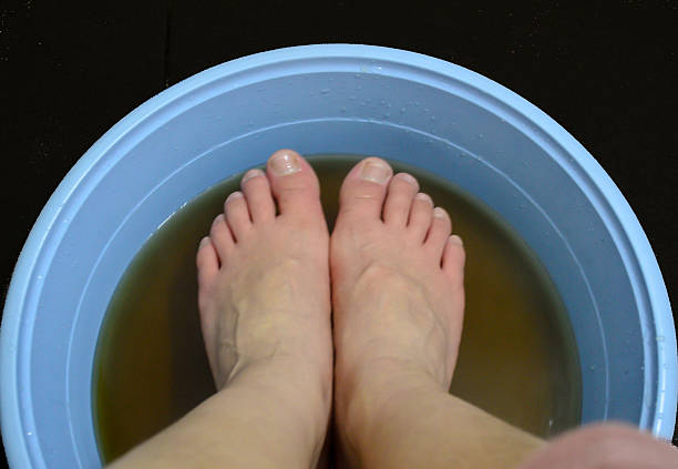 istock woman is using drugs liquid immersion foot 485311383