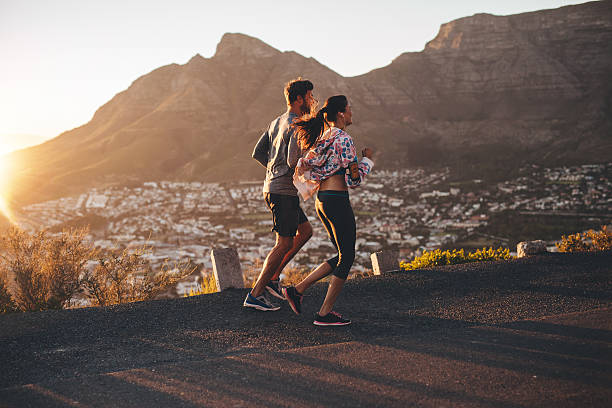 istock Young couple jogging in nature 485311464