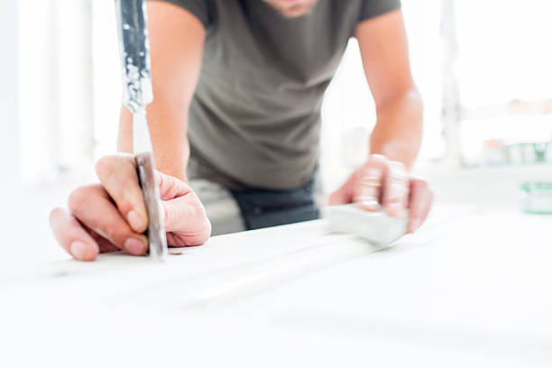 istock Man restorating old wooden doors 485311830