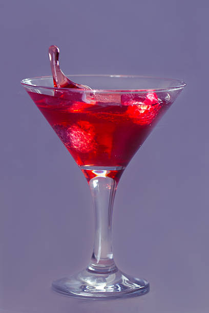 istock Drop of water falling in martini glass 485311999