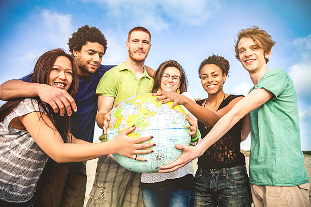 istock Group of friends holding an earth globe 485312715