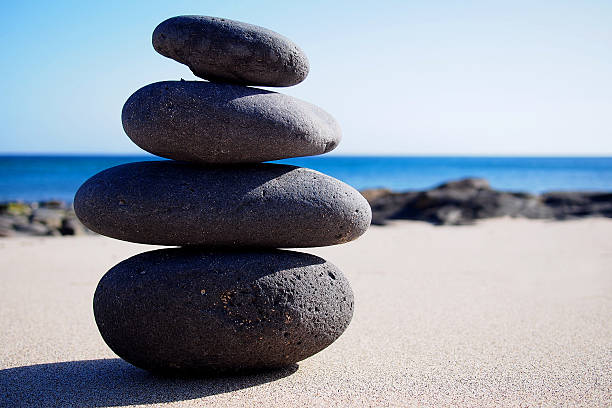 istock Stack of zen stones on the sand 485313397