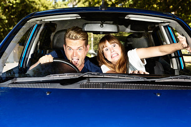 istock Auto accident in the making! Panic-stricken couple in car 485313445