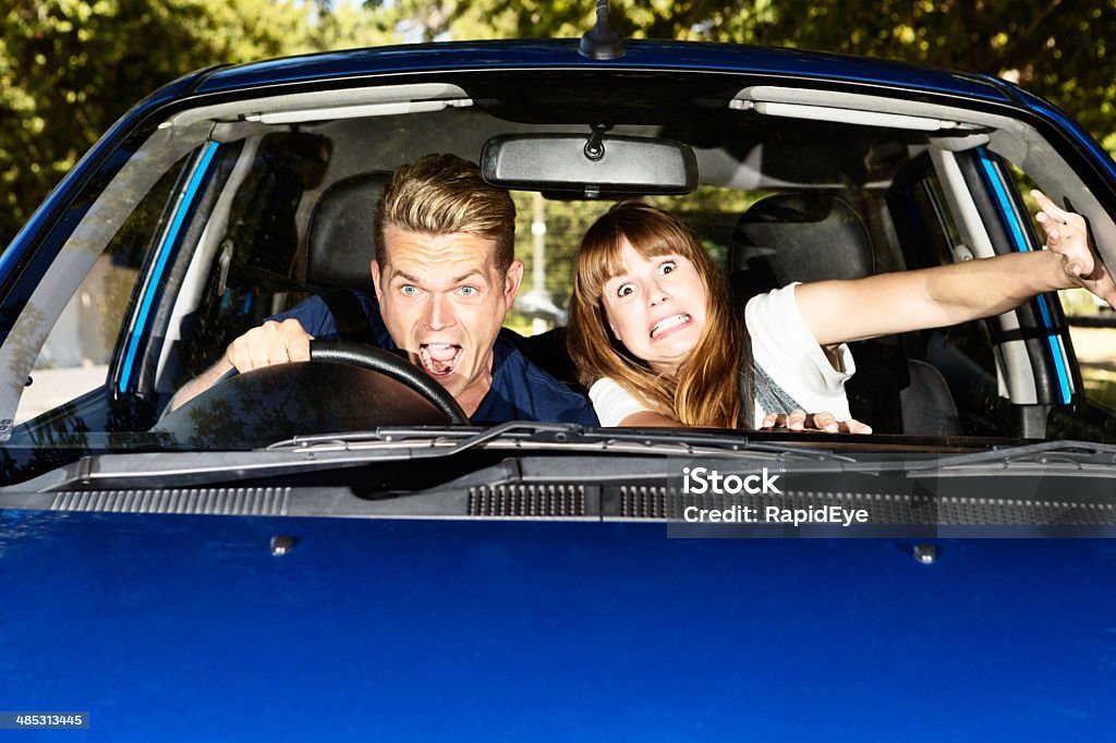 Auto accident in the making! Panic-stricken couple in car A shocked young couple in a car shriek in horror as they try to avoid an accident. It's an accident in the making! Car Stock Photo