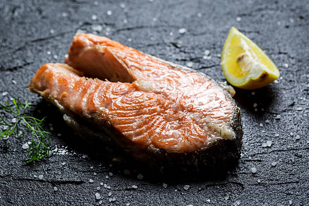 istock Freshly fried salmon served with dill and lemon 485314737