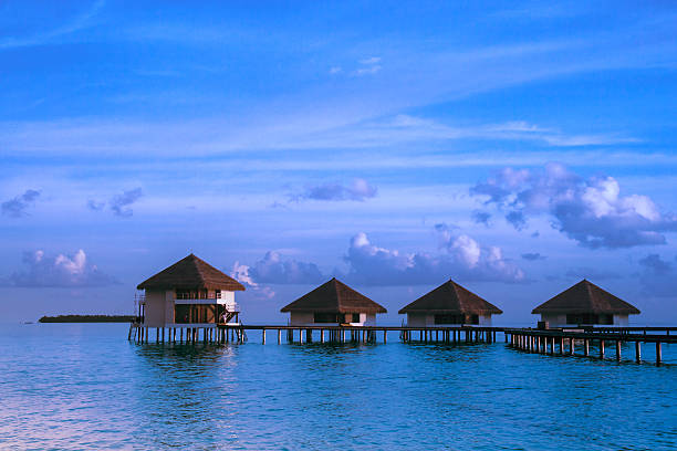 istock Over water bungalows with steps into amazing green lagoon 485315569