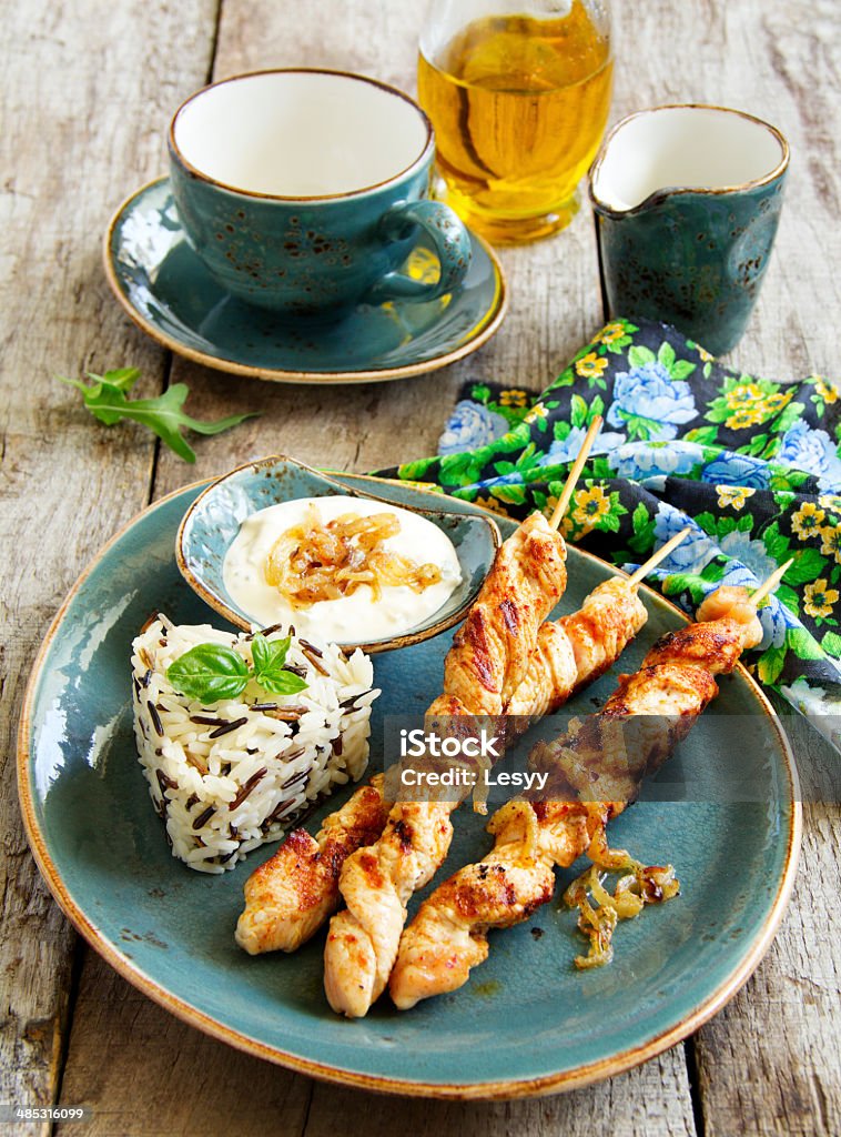 Barbecue beef skewers with sauce. Assistance Stock Photo