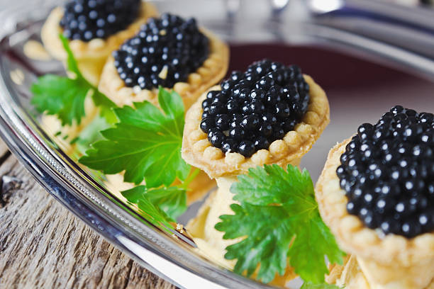 istock cake with black caviar and parsley 485316231