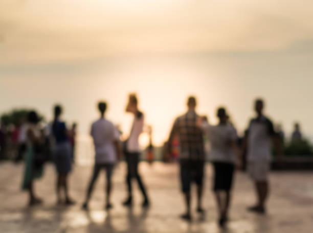 istock Blurred group of people during sunset 485316538