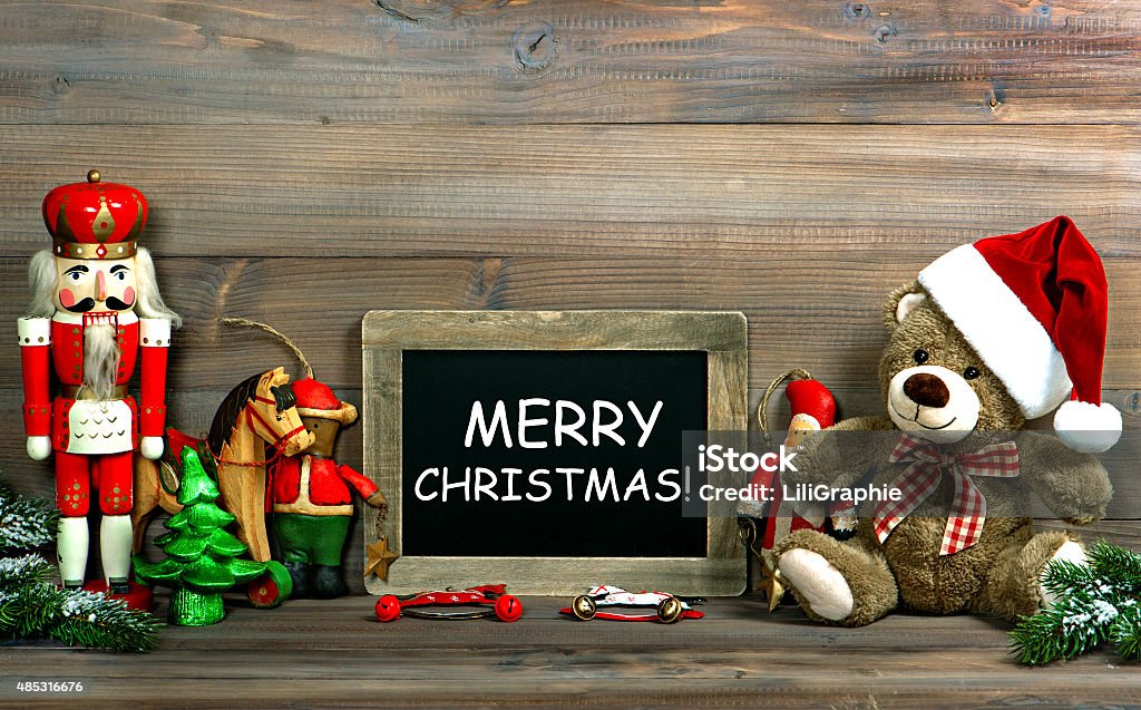 Christmas decoration with antique toys and blackboard Christmas decoration with antique toys and blackboard. Vintage style toned picture with sample text Merry Christmas Fashion Stock Photo