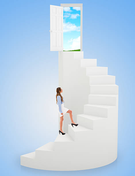 Successful business woman climbing the stairs