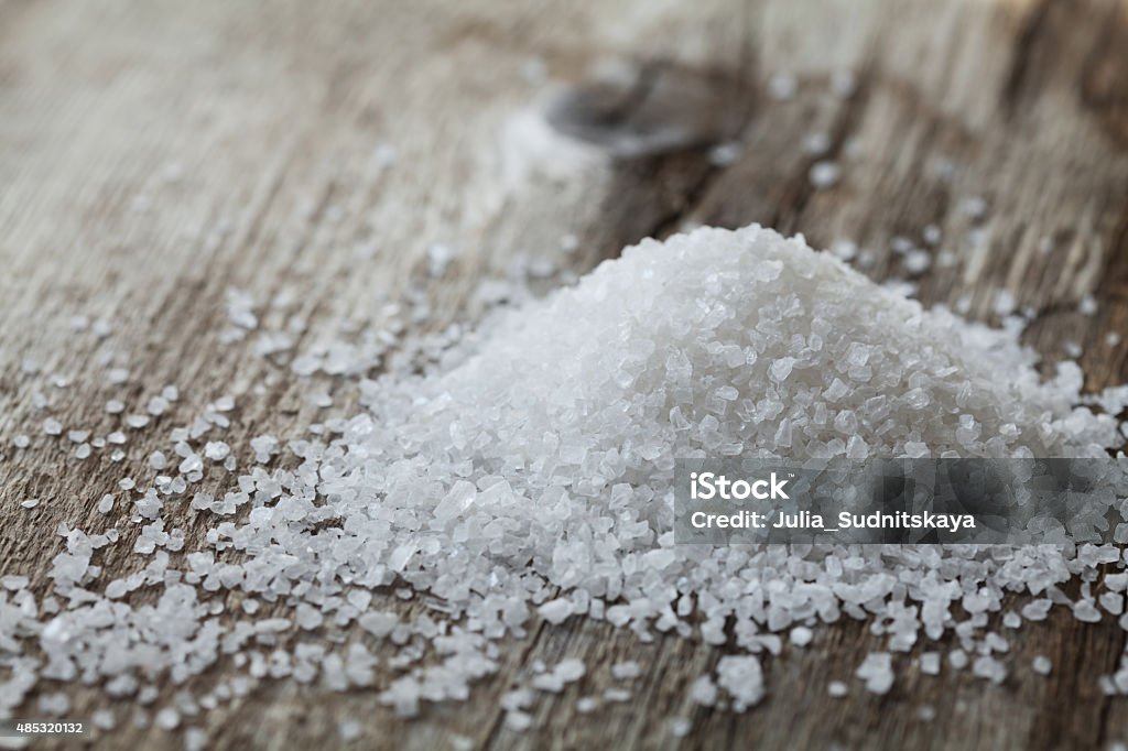 Sea salt heap on rustic table Sea salt on rustic wooden background 2015 Stock Photo