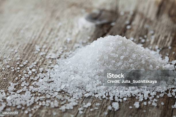 Sea Salt Heap On Rustic Table Stock Photo - Download Image Now - 2015, Beauty Treatment, Close-up