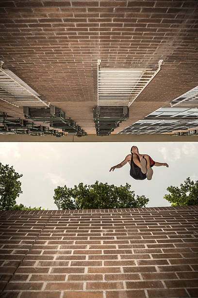 istock Young man practicing parkour in the city 485321134