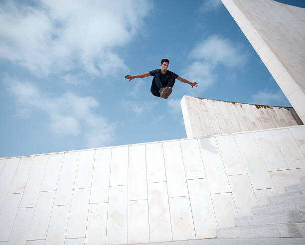Young man practicing parkour in the city