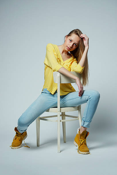istock girl with long hair posing in studio 485321804