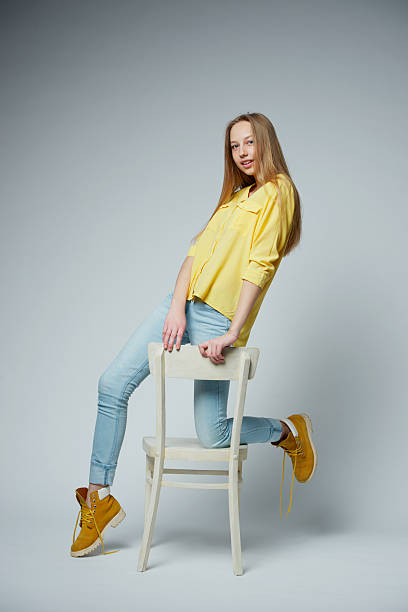 istock girl with long hair posing in studio 485322698